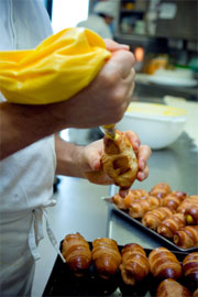 man filling pastries